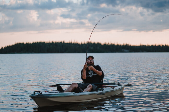 Fisherman uses a fishing kayak at Sas Lodge